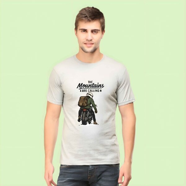 Mountains T-Shirt for Men featuring biker riding into the mountains with “The Mountains Are Calling” quote – 2025 edition